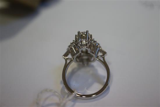 An attractive 18ct white gold and diamond cluster elliptical shaped ring, size M/N.